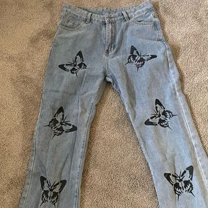 straight leg boot cut blue jeans with black butterflies